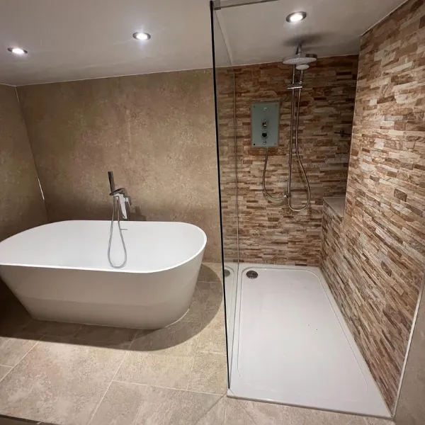 A walk in shower and free standing bath that our bathroom installers fitted in Caerphilly
