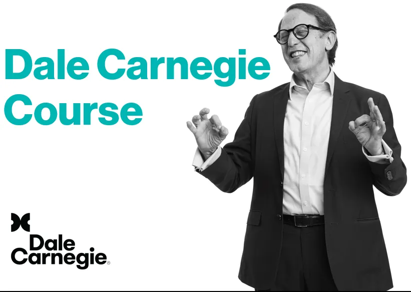 person holding pencil near laptop computer