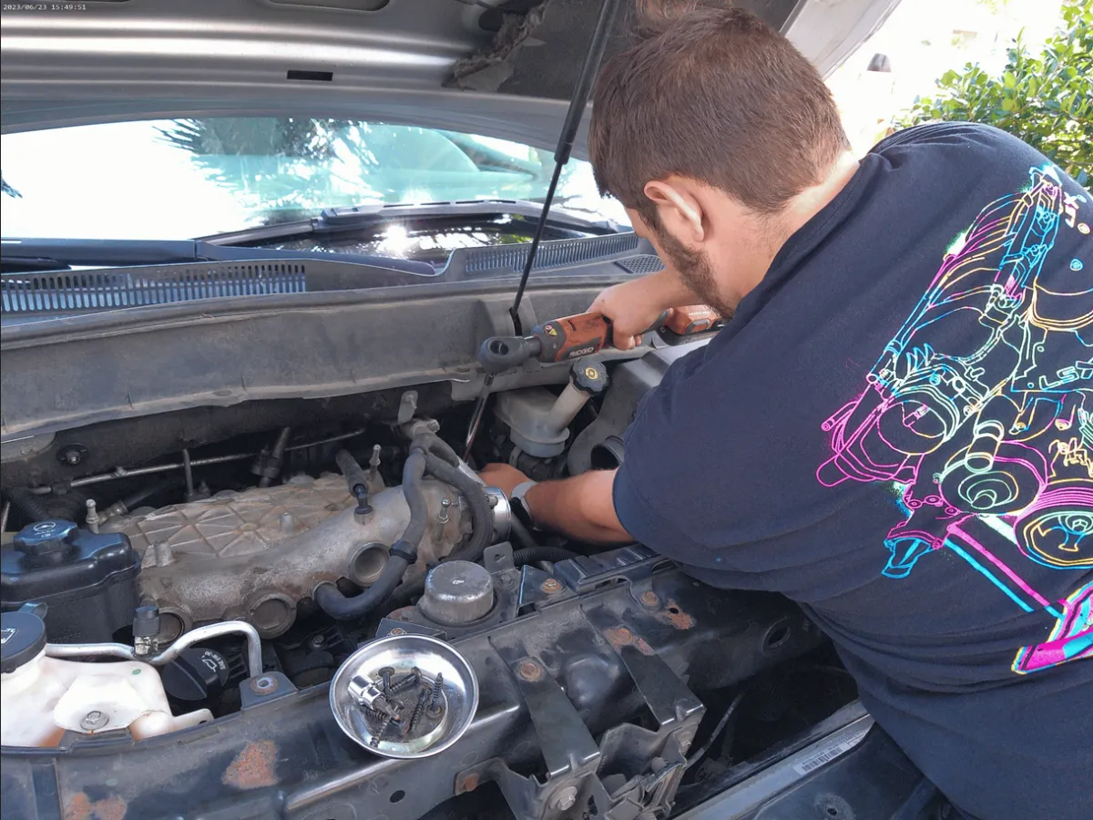Hunter Hutton, owner of Jax Cruisers, working on a car.