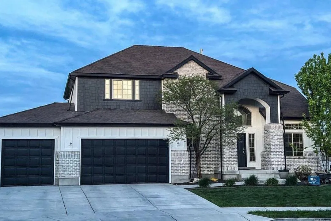 white and brown building near body of water during daytime