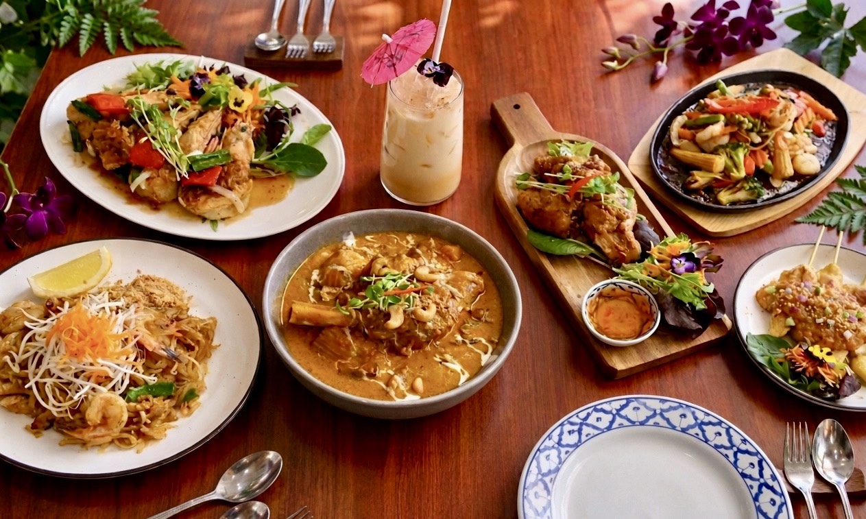 Table spread of colourful Thai dishes at Berry Thai Restaurant