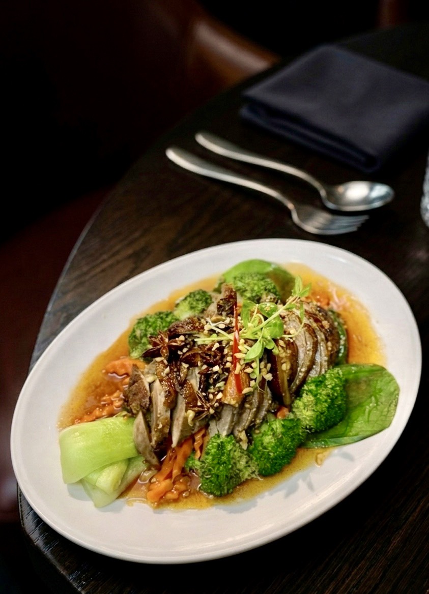 Chefs preparing authentic Thai food in a clean kitchen