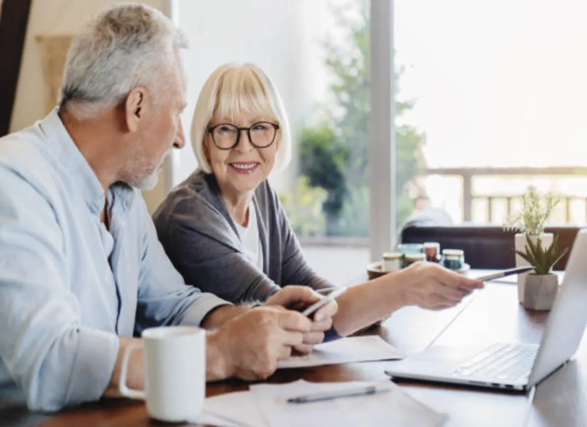 Canadian seniors reviewing reverse mortgage documents at home