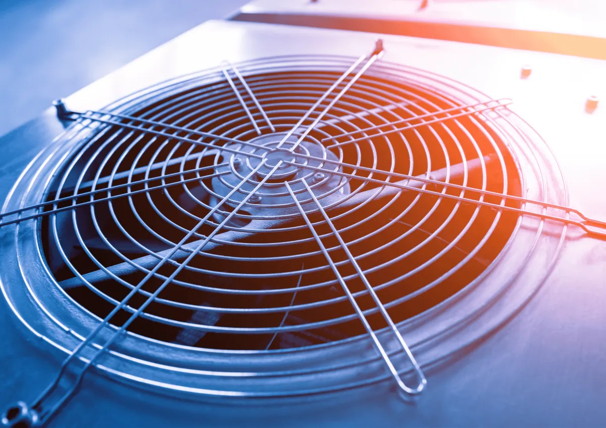 a wall mounted air conditioner mounted on the side of a building