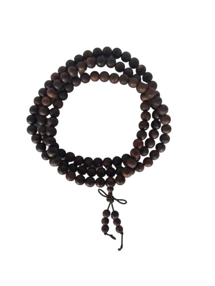 Buddhist mala beads on a neutral background