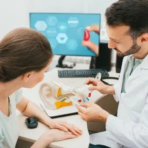 audiologist talking to a patient