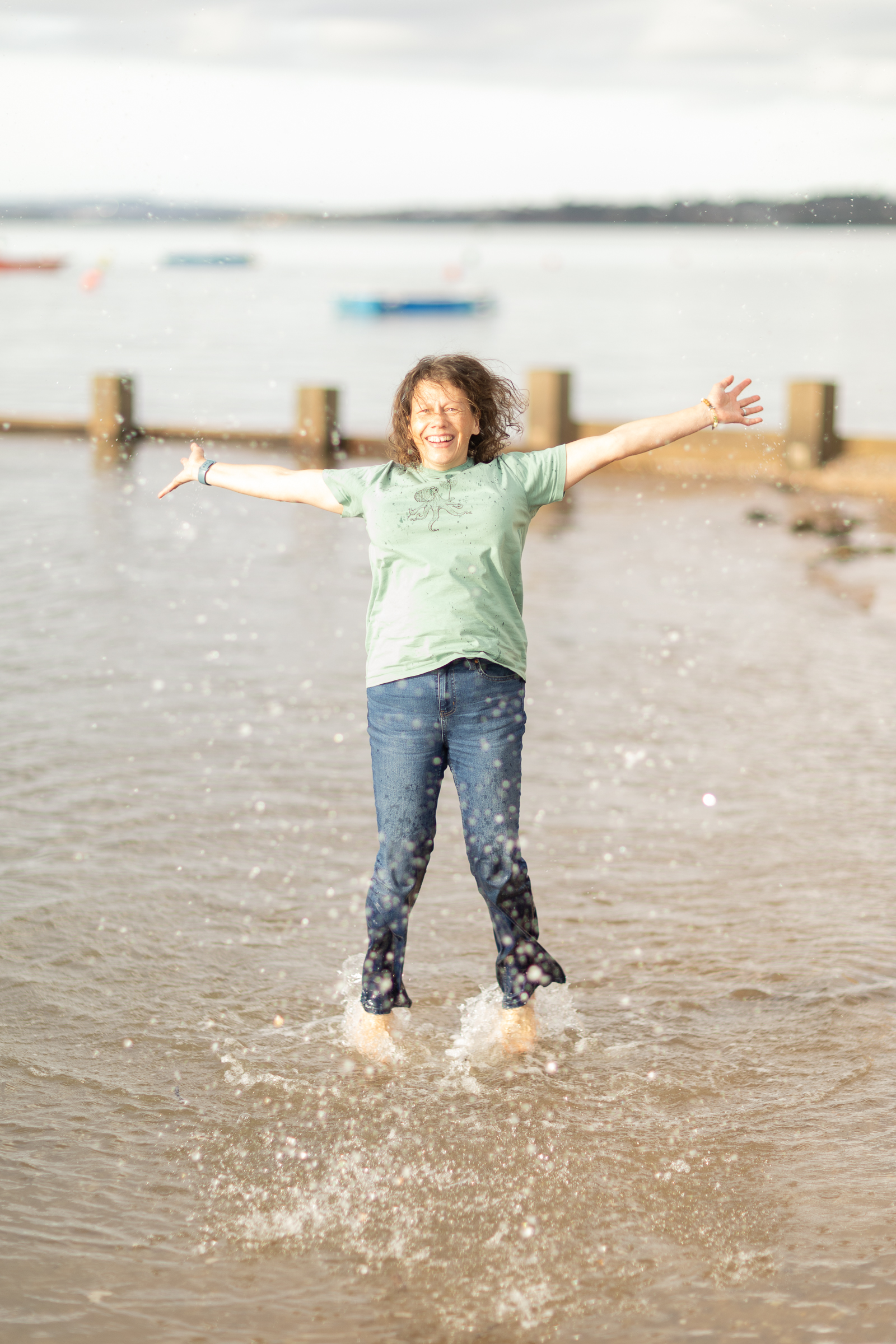 woman jumping in water