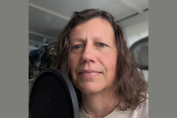 female behind a microphone