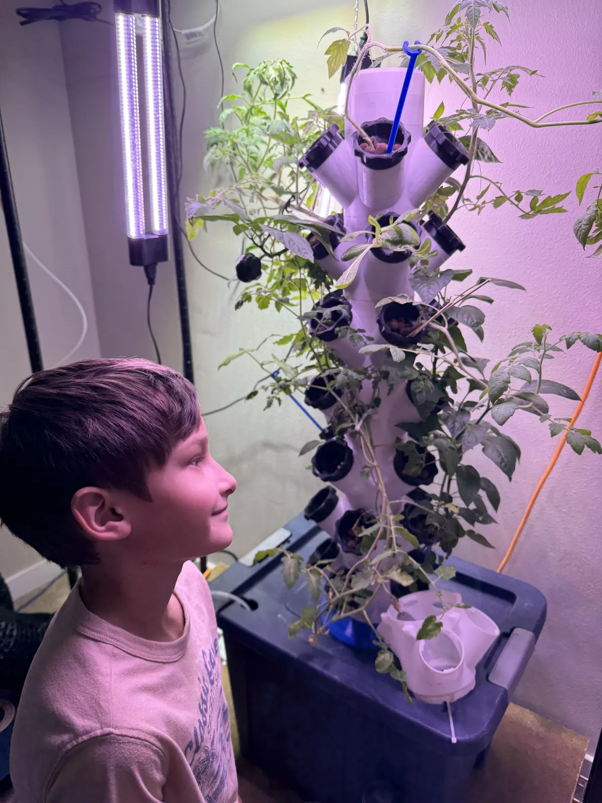woman in black sweater holding white and black vr goggles