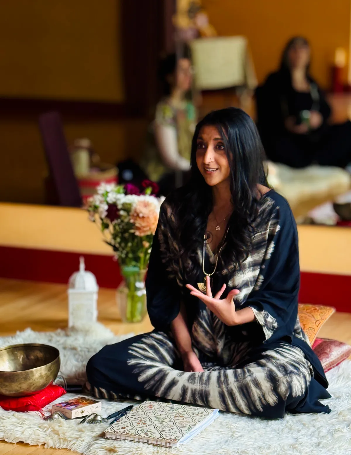 Aria Tau facilitating an intimate gathering of women