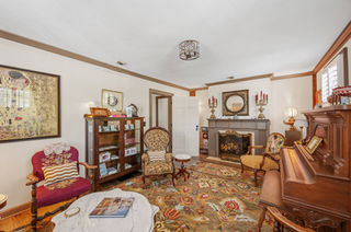 Main Level Living Room Featuring Functional Antique Piano