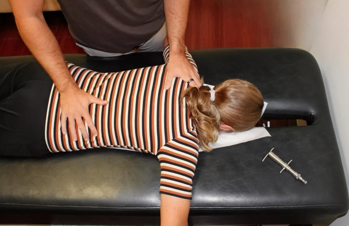 a woman is giving a boy a high five