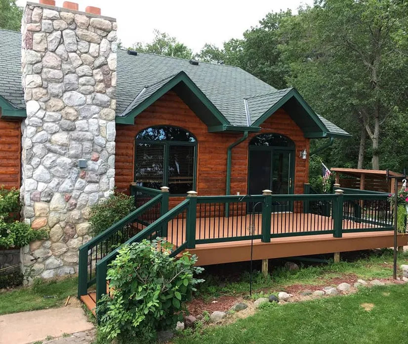 Horizon Painting founders in front of a freshly painted Minnesota lake home