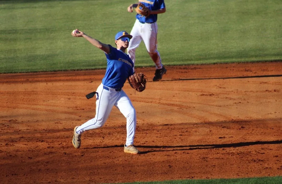 baseball playing posing to hit ball