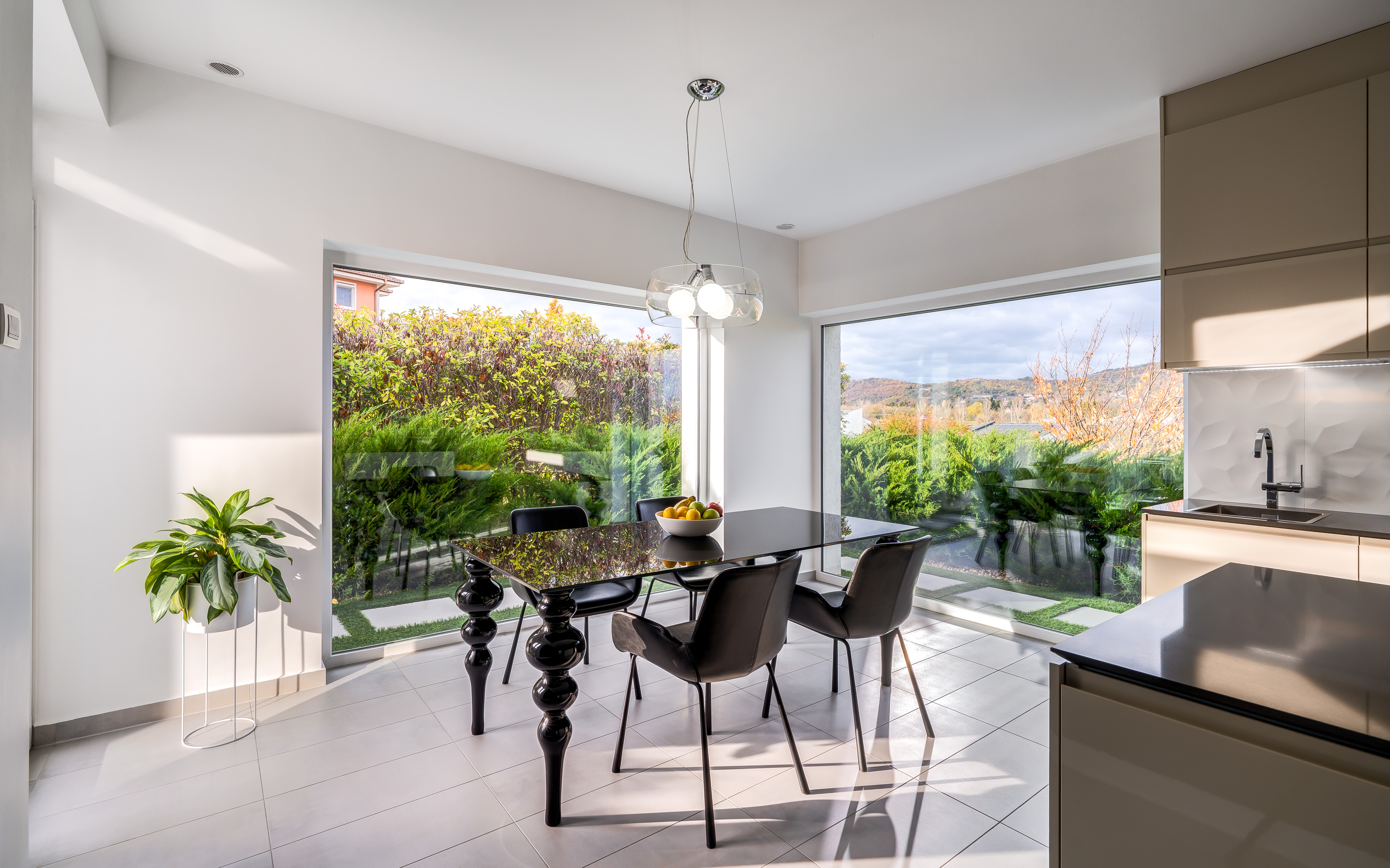 Skyview Home kitchen and dining area with panoramic garden view
