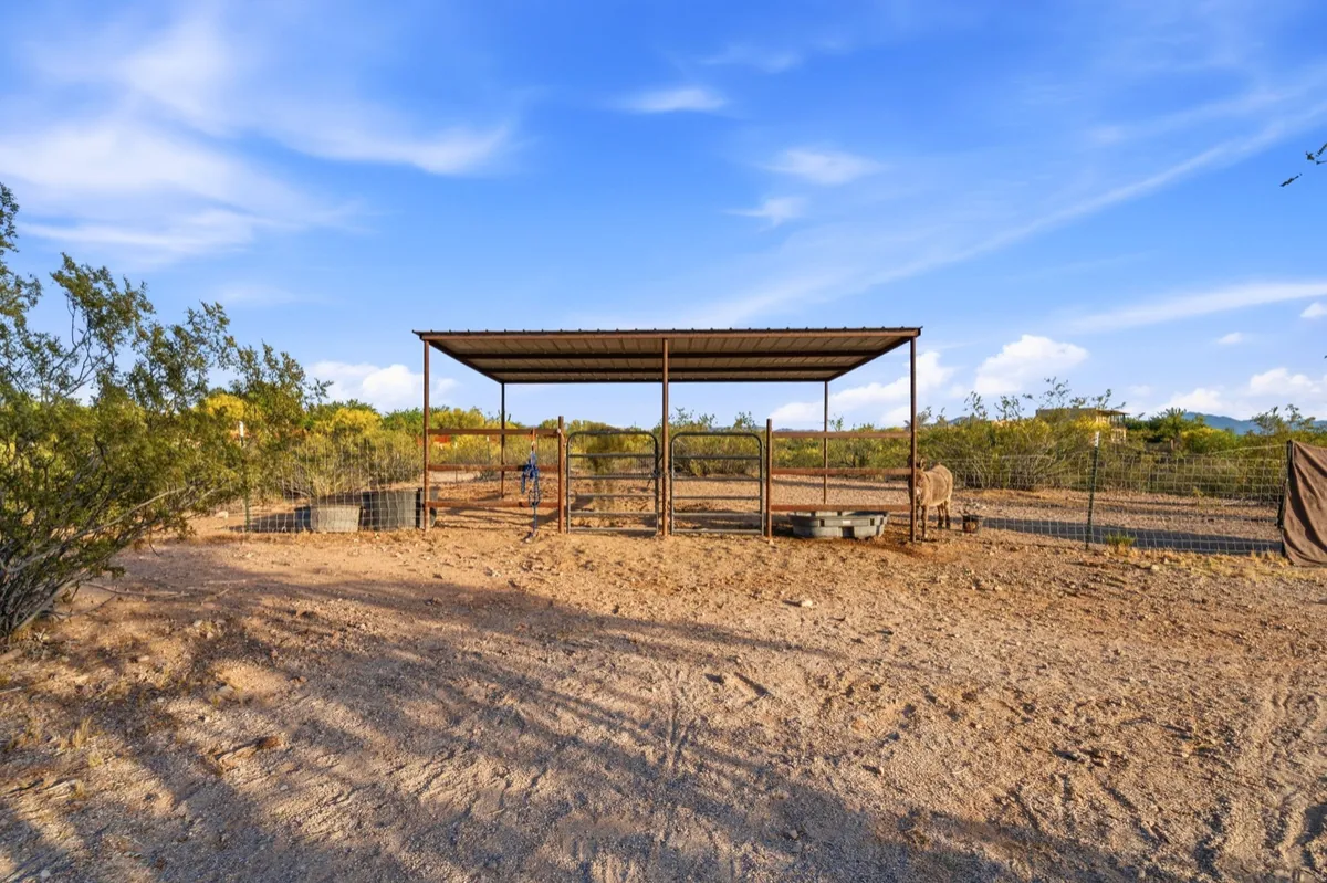 Horse corral and shade ramada at a Tucson horse property listed by Meagan Estees
