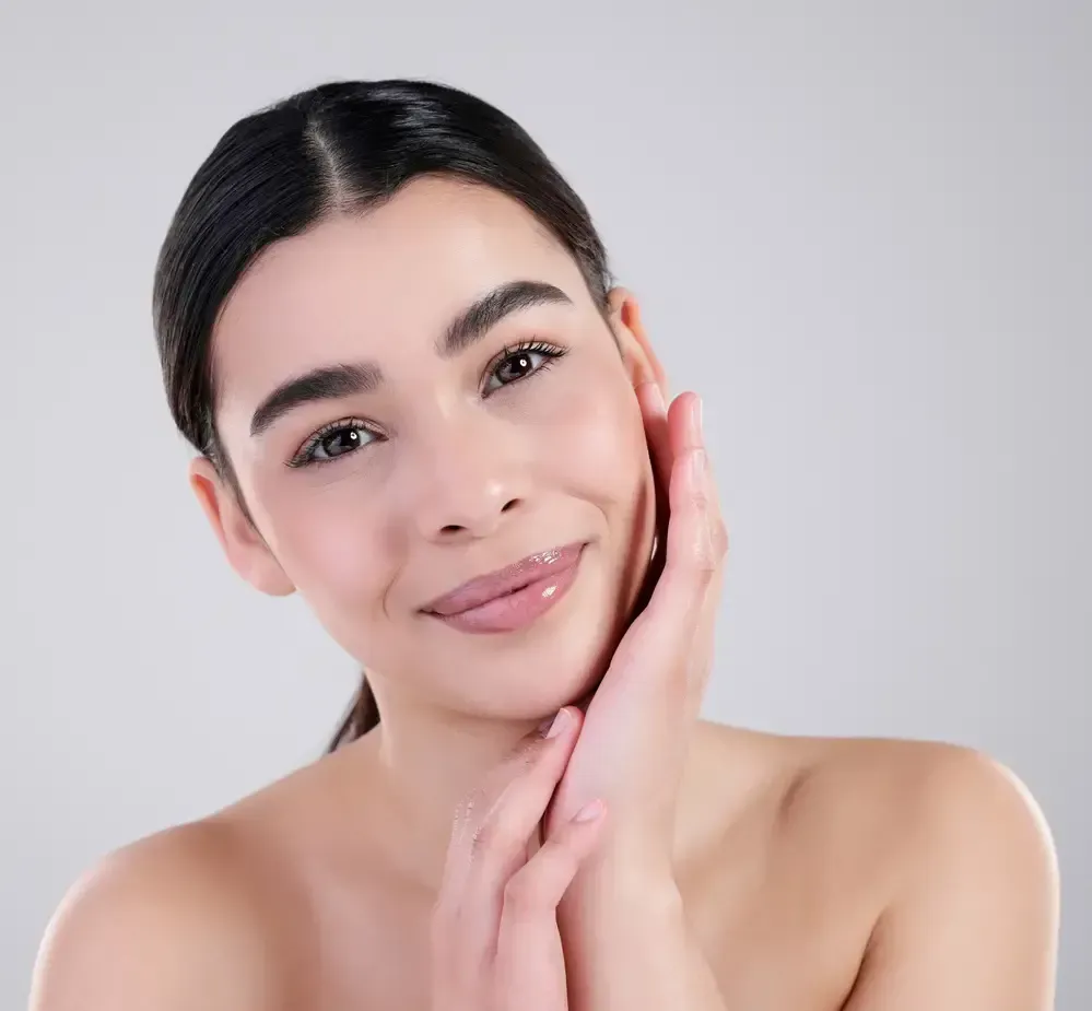 A wooden sauna overlooks a forest view.
