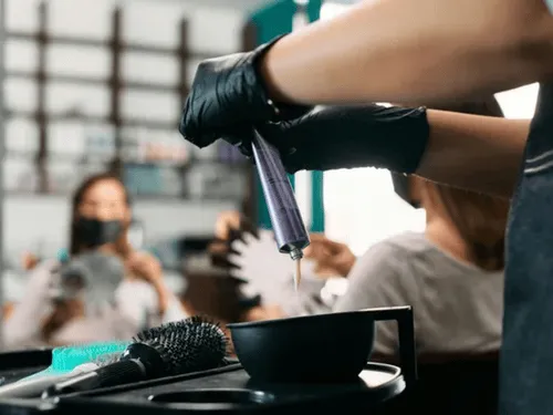 a woman holding a water bottle in her right hand