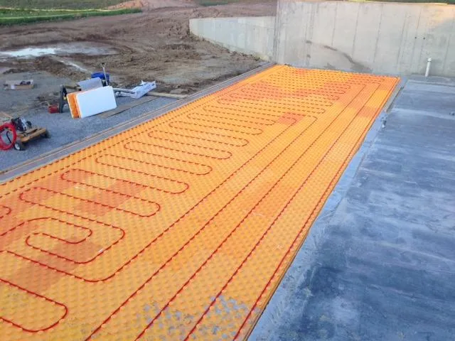 Creatherm hydronic heating tubes embedded in radiant panel for ICF home