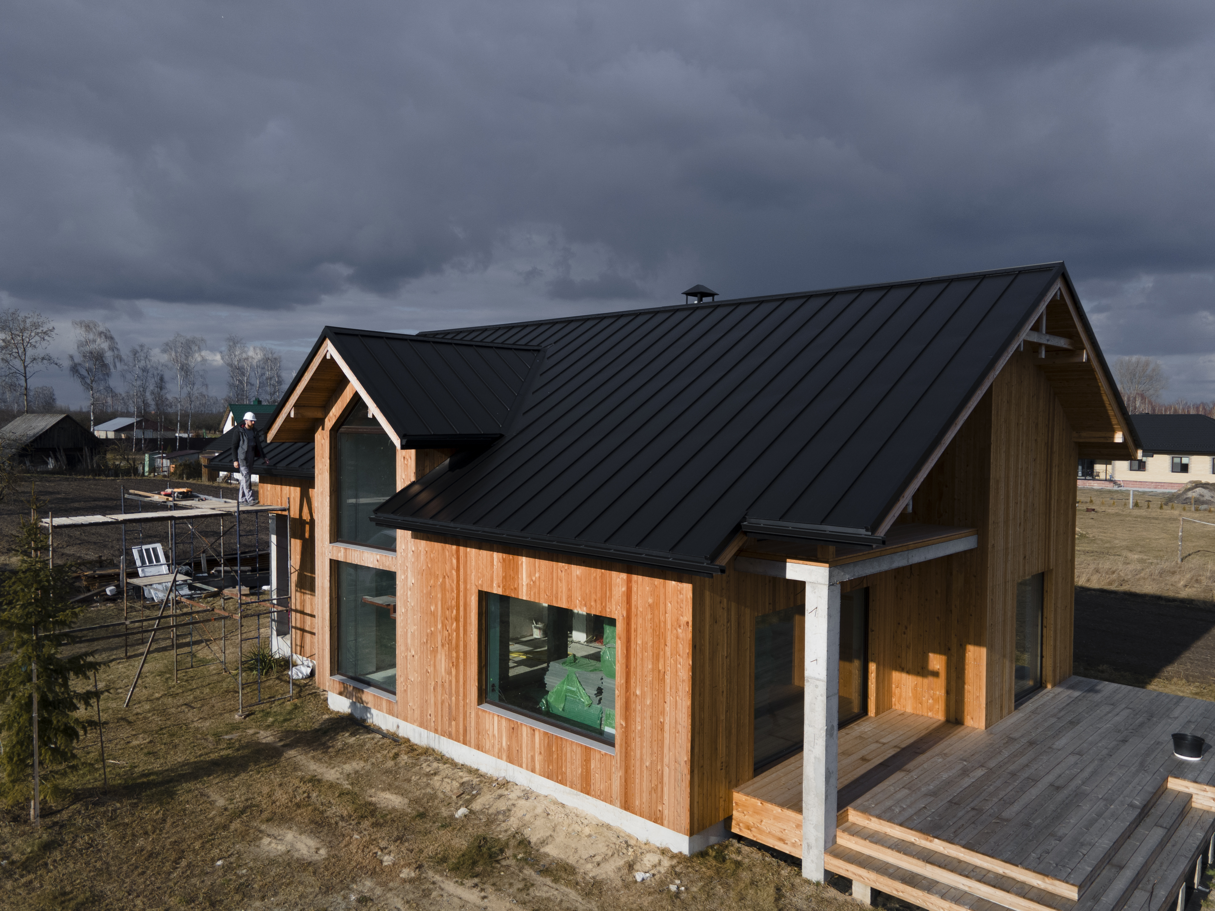 Finished product photo of Burmon truss hanger on new construction of Stronghold ICF home in Boston, Massachusetts