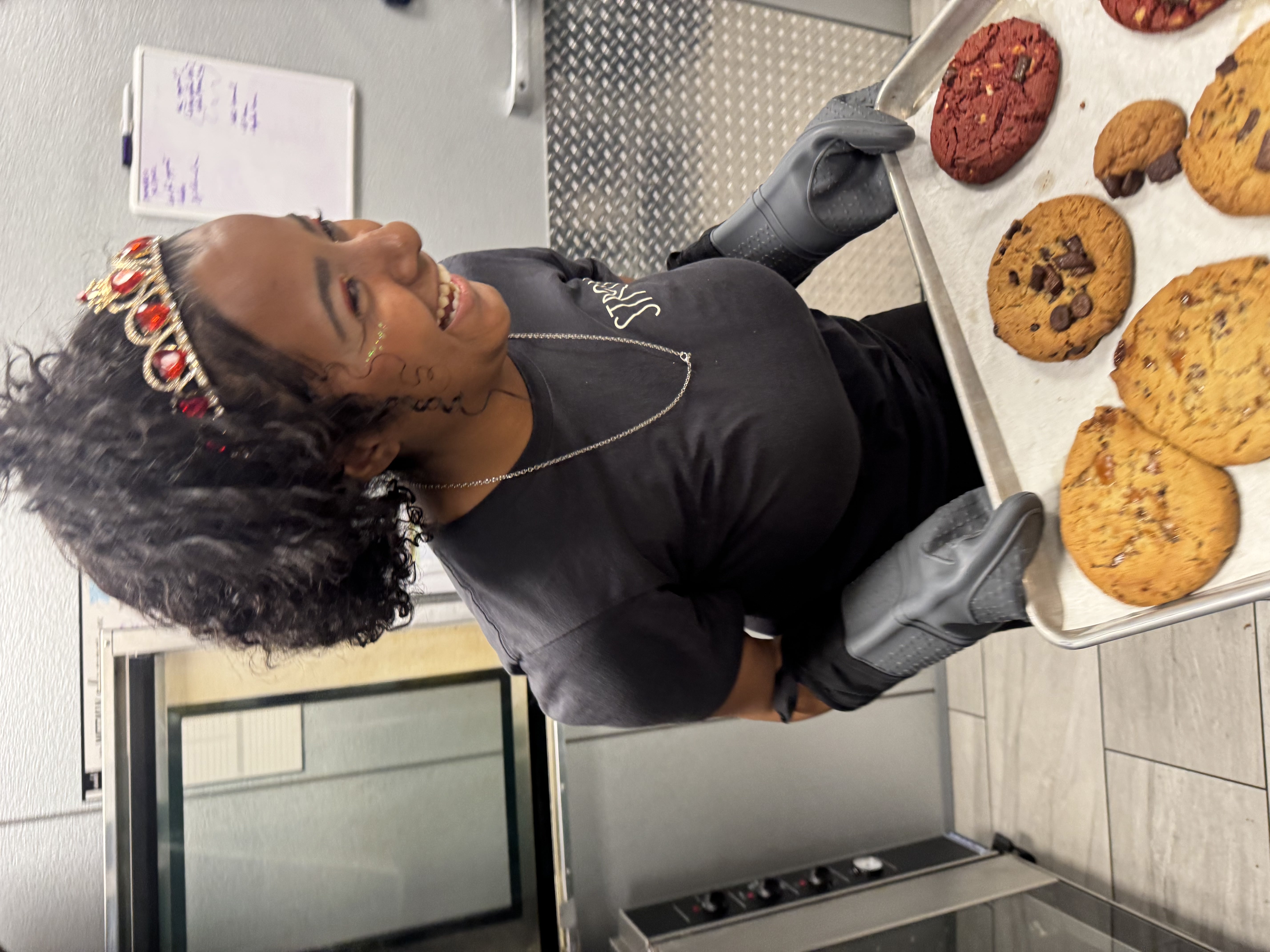 Stroll Cafe bartender carefully crafting a specialty cocktail with edible glitter, demonstrating the detail-oriented and fast-paced hospitality our staff provides