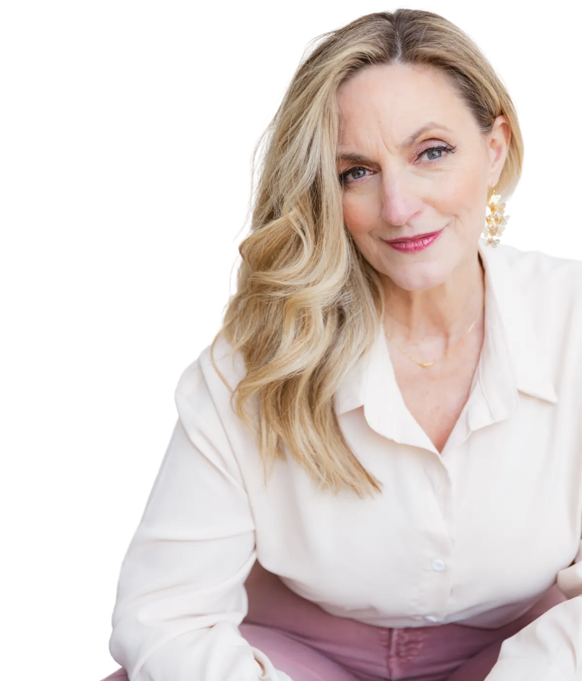 Lisa Williams, world-renowned psychic medium and teacher, sitting and smiling