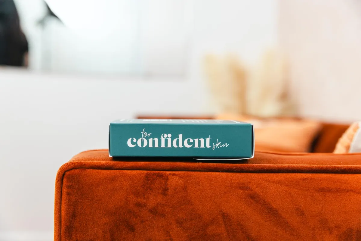 a hotel room with two beds and a couch