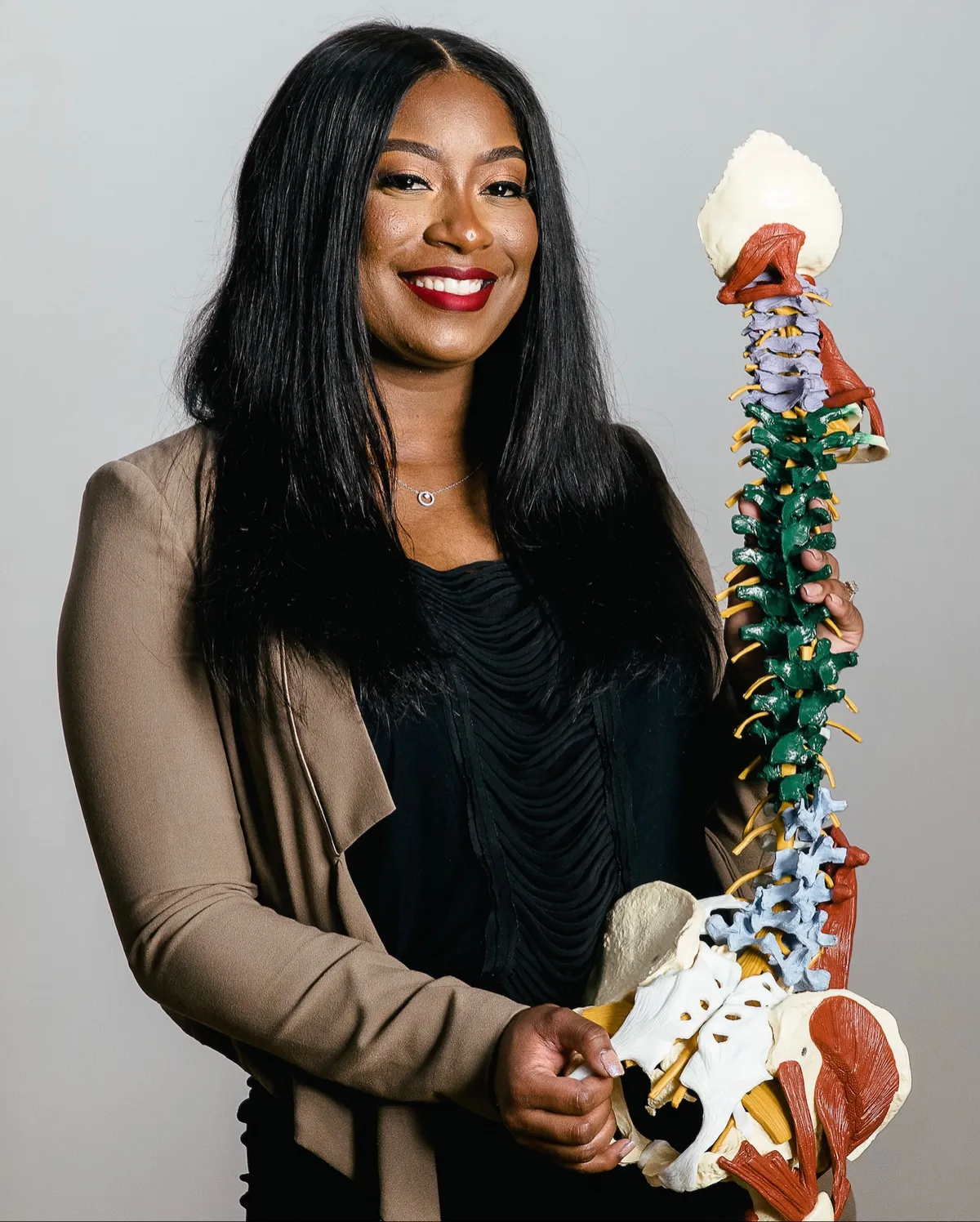 Portrait photograph of Dr. Sheneé Harris, D.C., MSCP in clinic