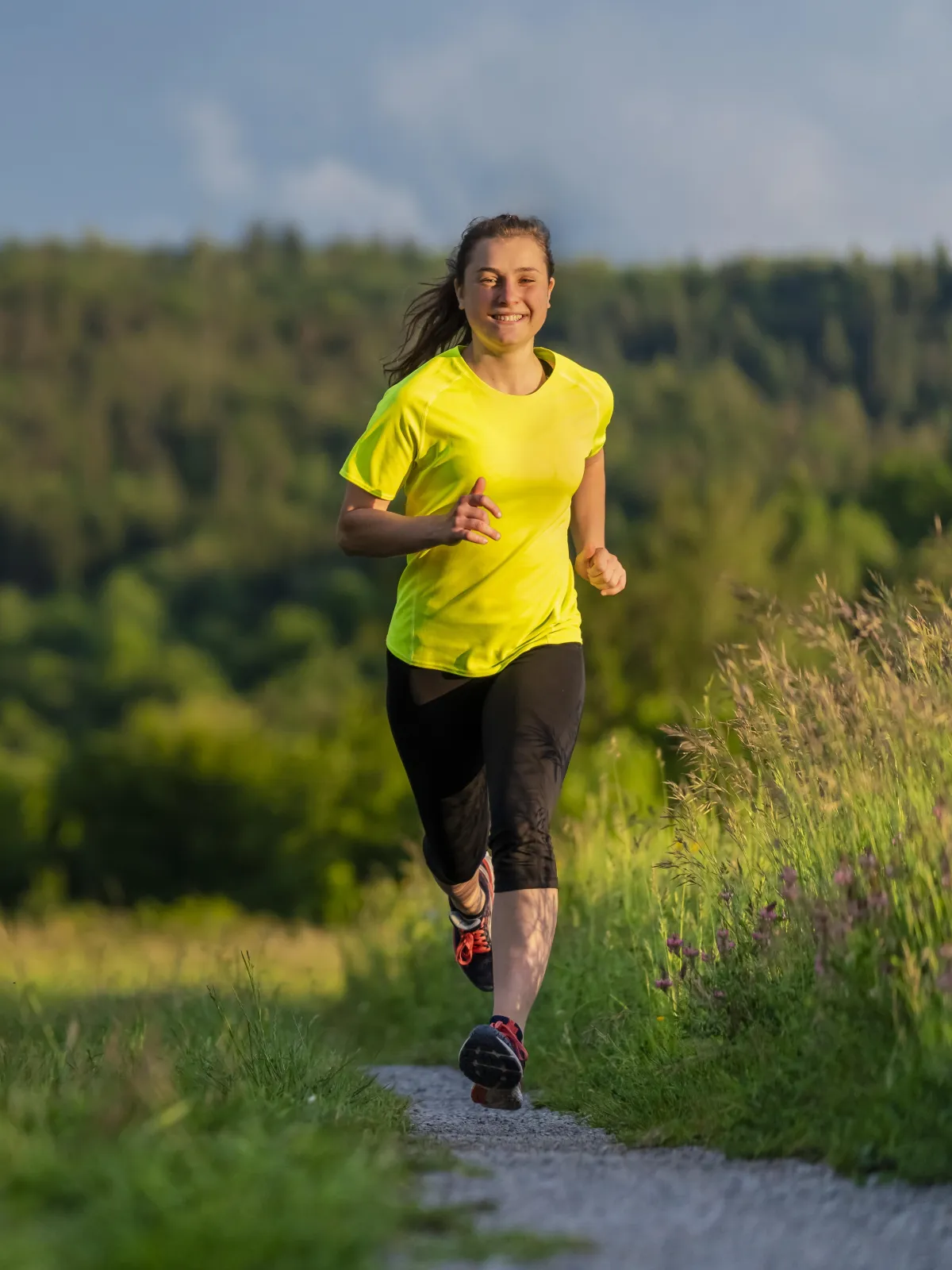 Young woman running in the countryside