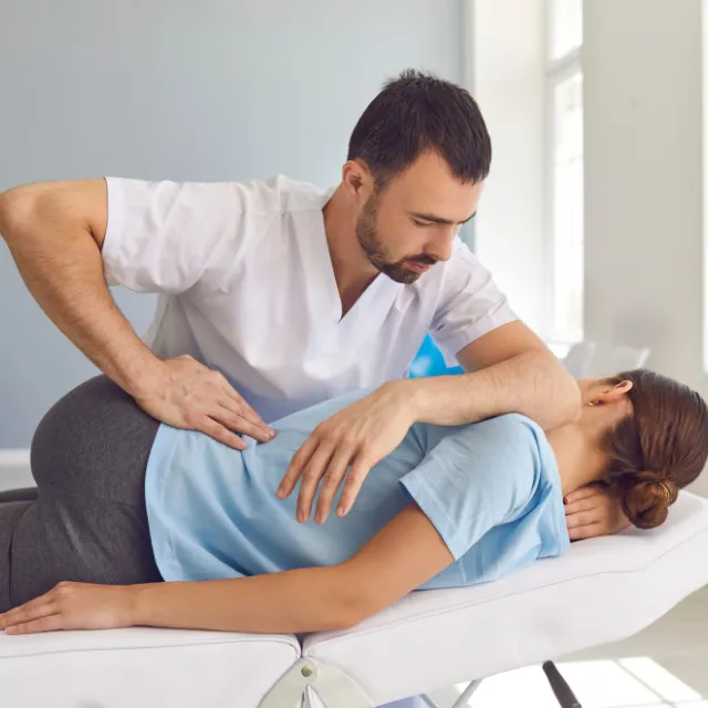 Plano chiropractor performing a precision spine adjustment on a patient