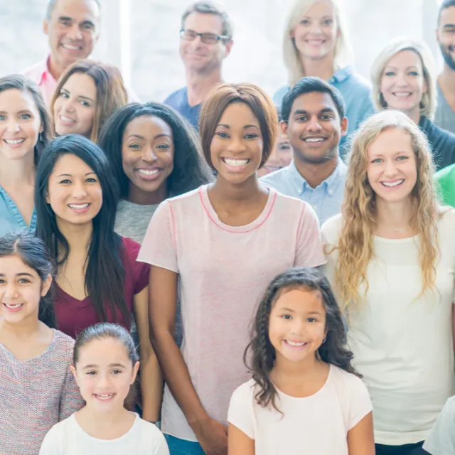 Group of Plano community members smiling together