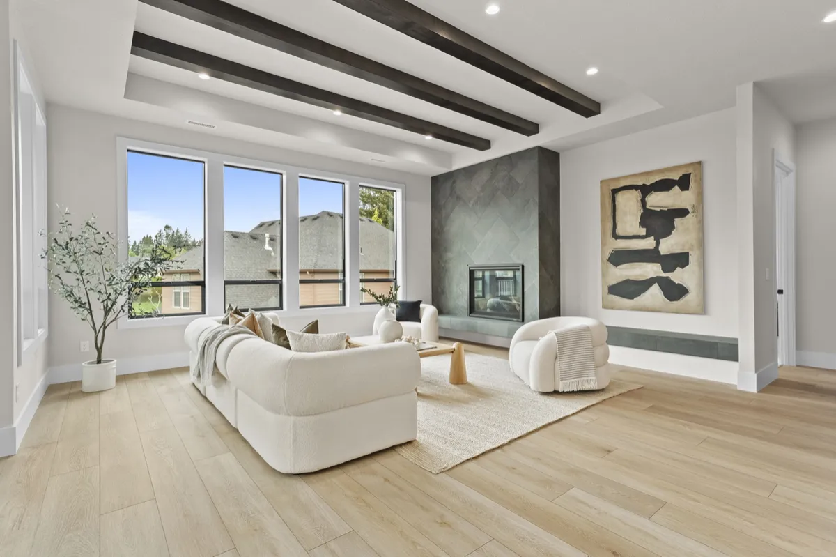 Bright living room with ceiling beams and neutral furnishings