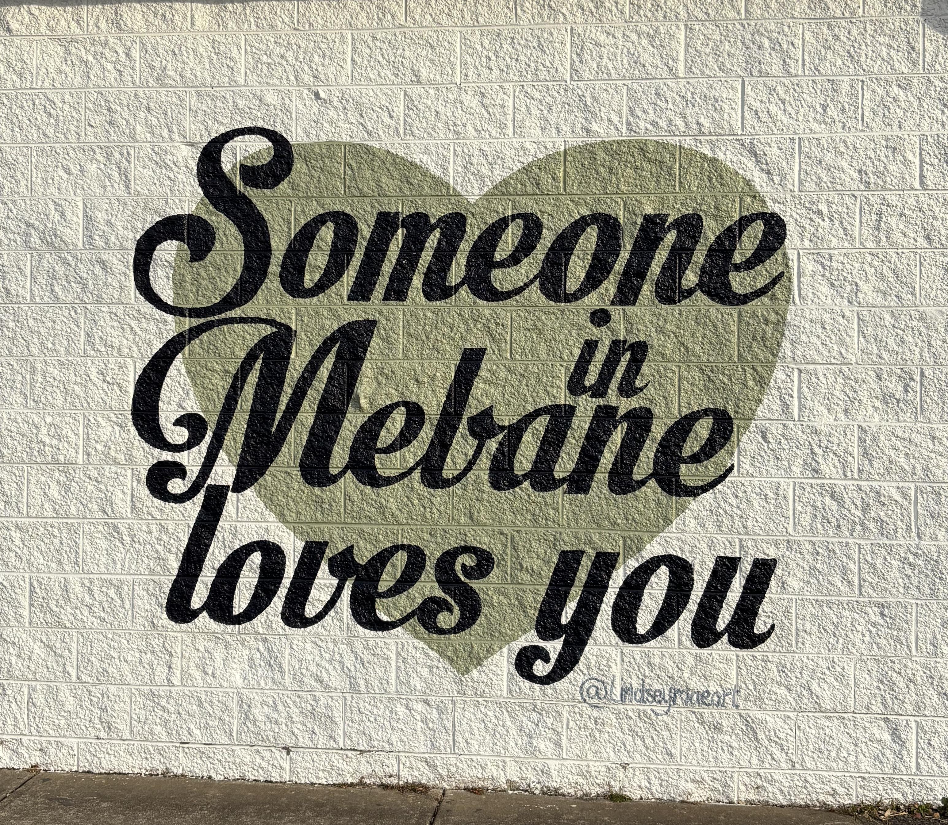 Someone in Mebane Loves You mural in downtown Mebane