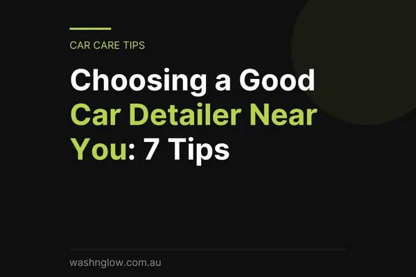 Professional hand car detailing service with a technician cleaning a vehicle by hand at Wash N Glow