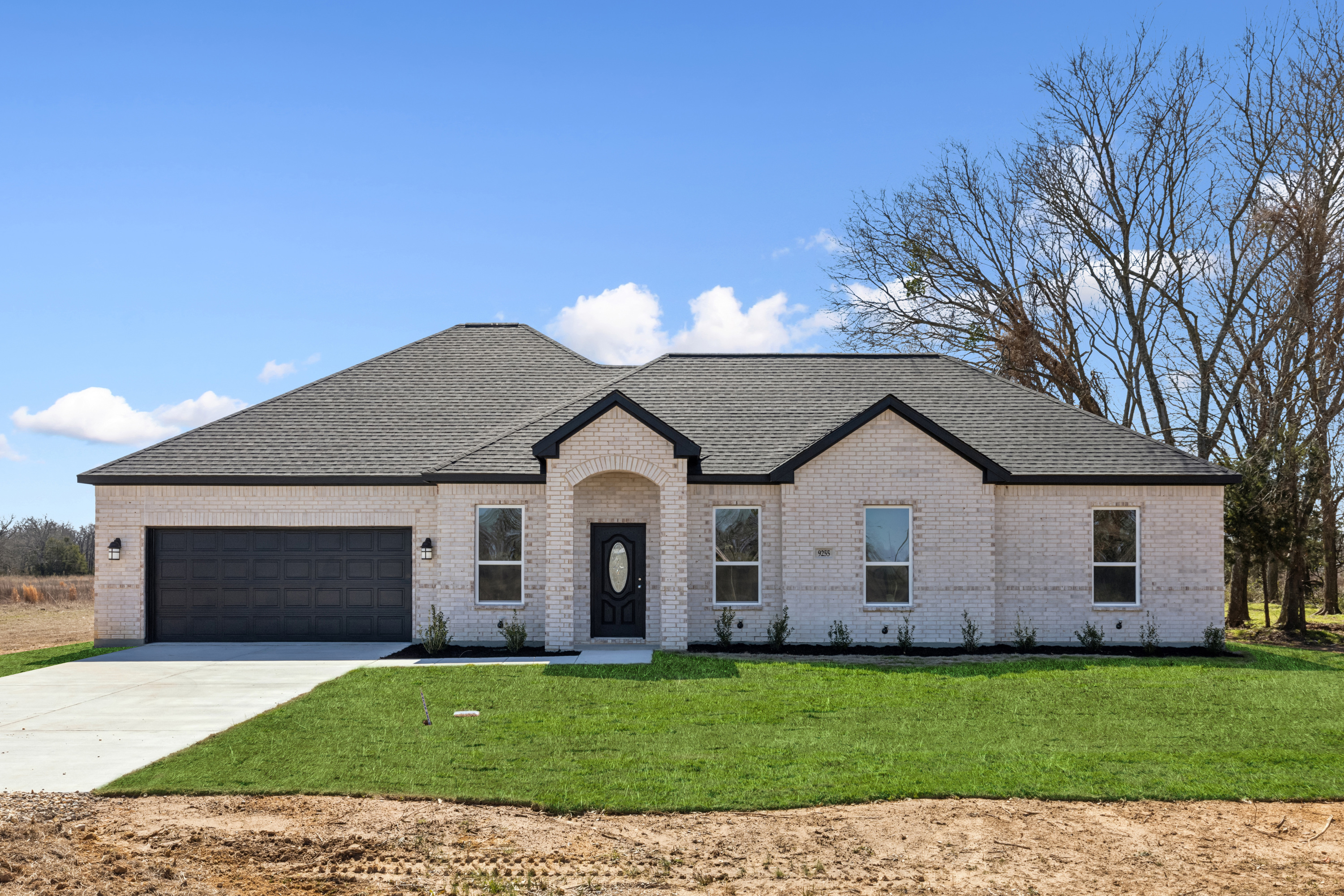 Urban farmhouse custom home exterior with front porch by Texas Prime