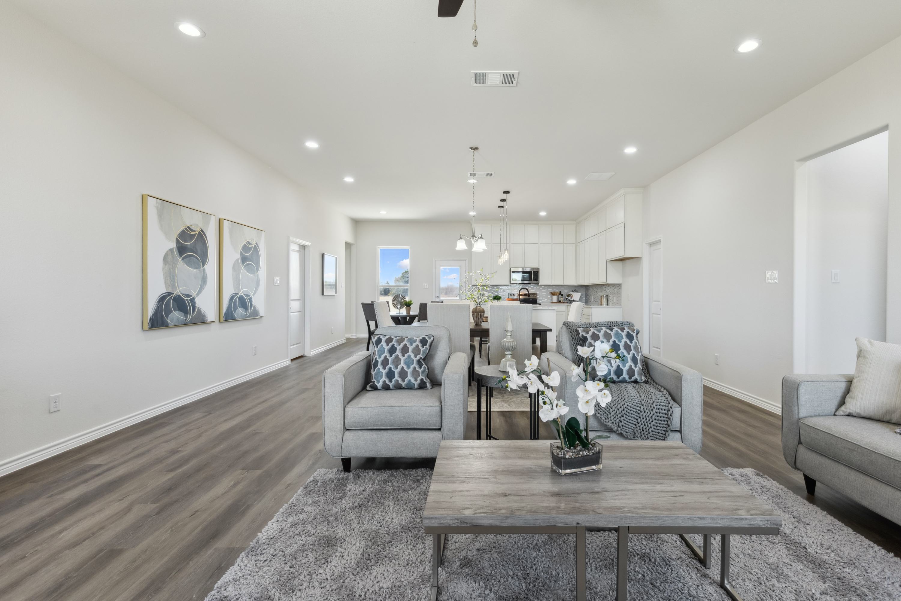 Texas Prime farmhouse kitchen with white cabinetry and wood beams