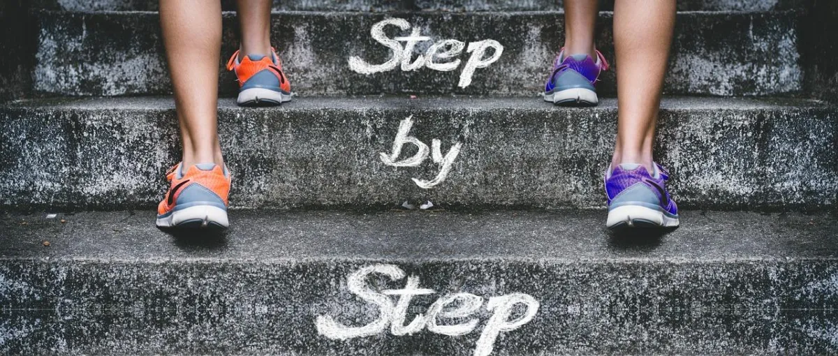 image of 2 runners running up steps