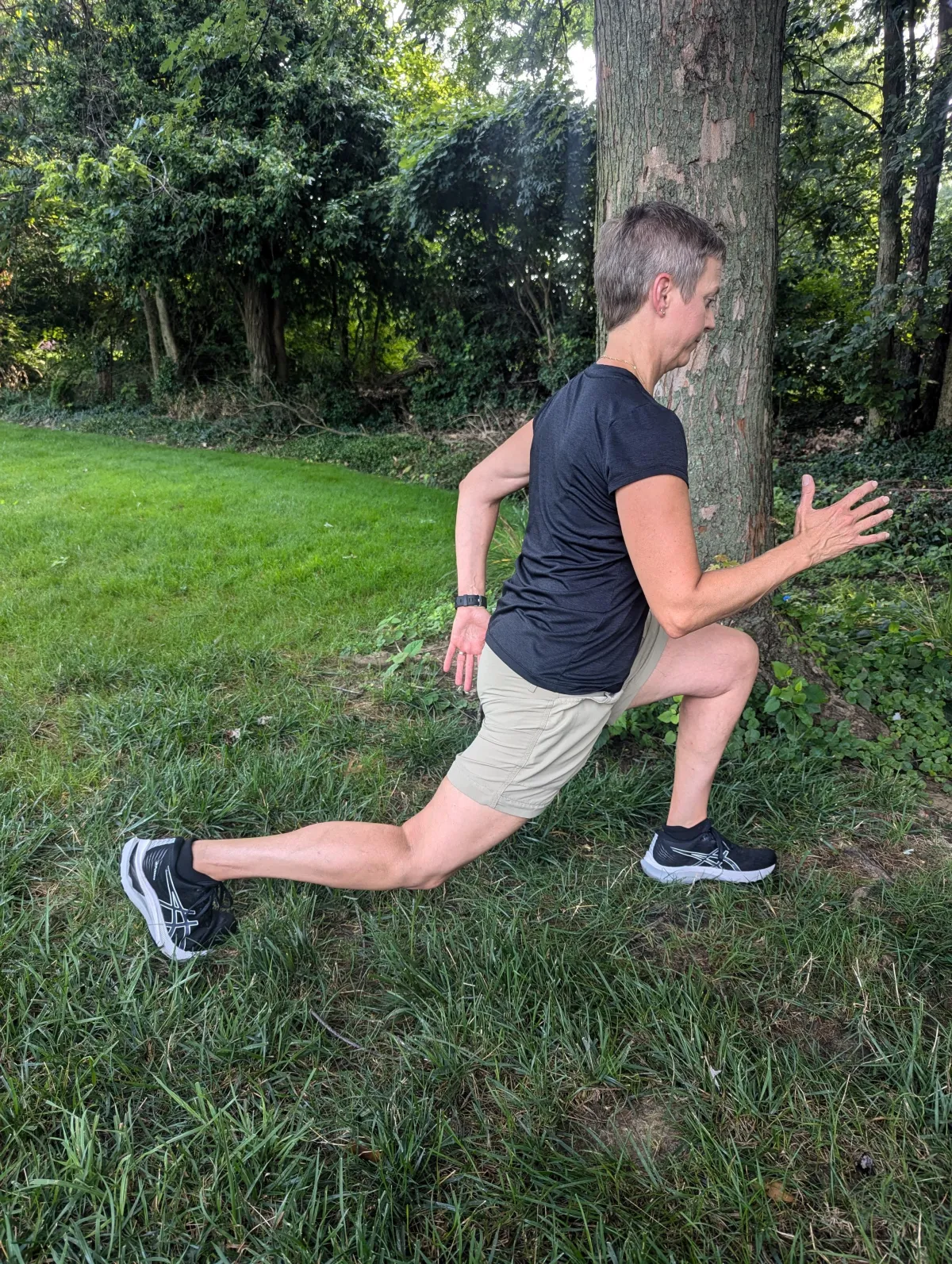 Dr. Jeanette demonstrating an outdoor lunge exercise to improve symmetry, mobility, and strength for active adults.