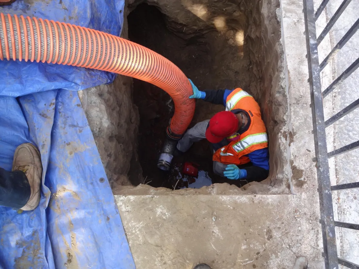 Plumber installing an appliance