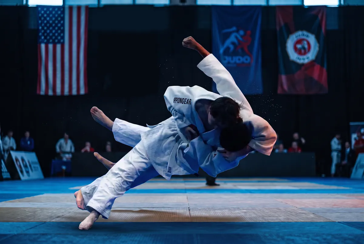 Teen judokas executing technical nage-no-kata throws with precision