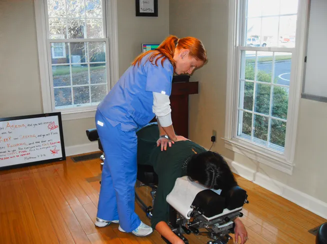 person holding brass-colored song bowl set