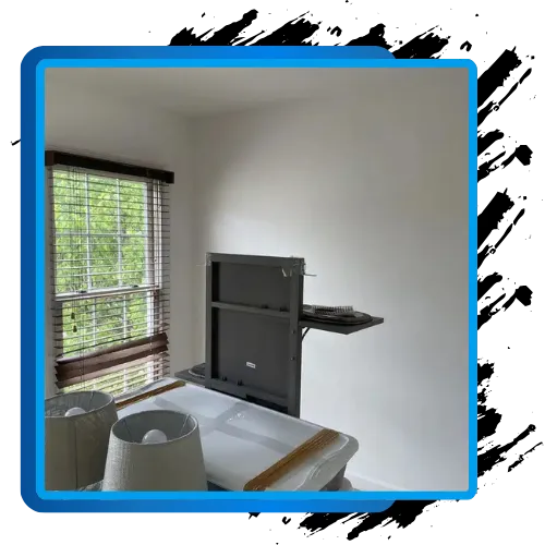 Interior wall painting and freshly painted room with window and wall-mounted shelf.