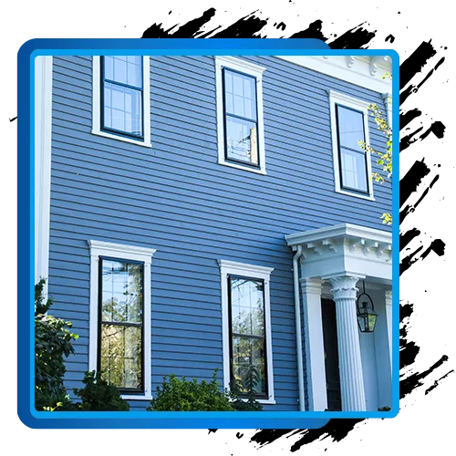 Exterior painting of a blue house in Bethesda, MD, showcasing curb appeal and durable finishes.