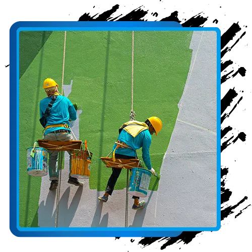 Commercial exterior painters using safety harnesses and equipment for building painting.