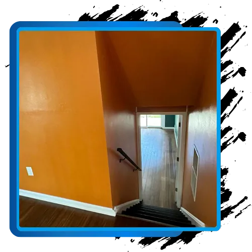 Interior painting project with orange walls and staircase in Washington, DC