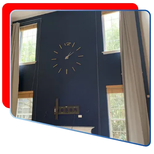 Interior wall painted in deep blue showcasing Liberty Painting's craftsmanship and design.