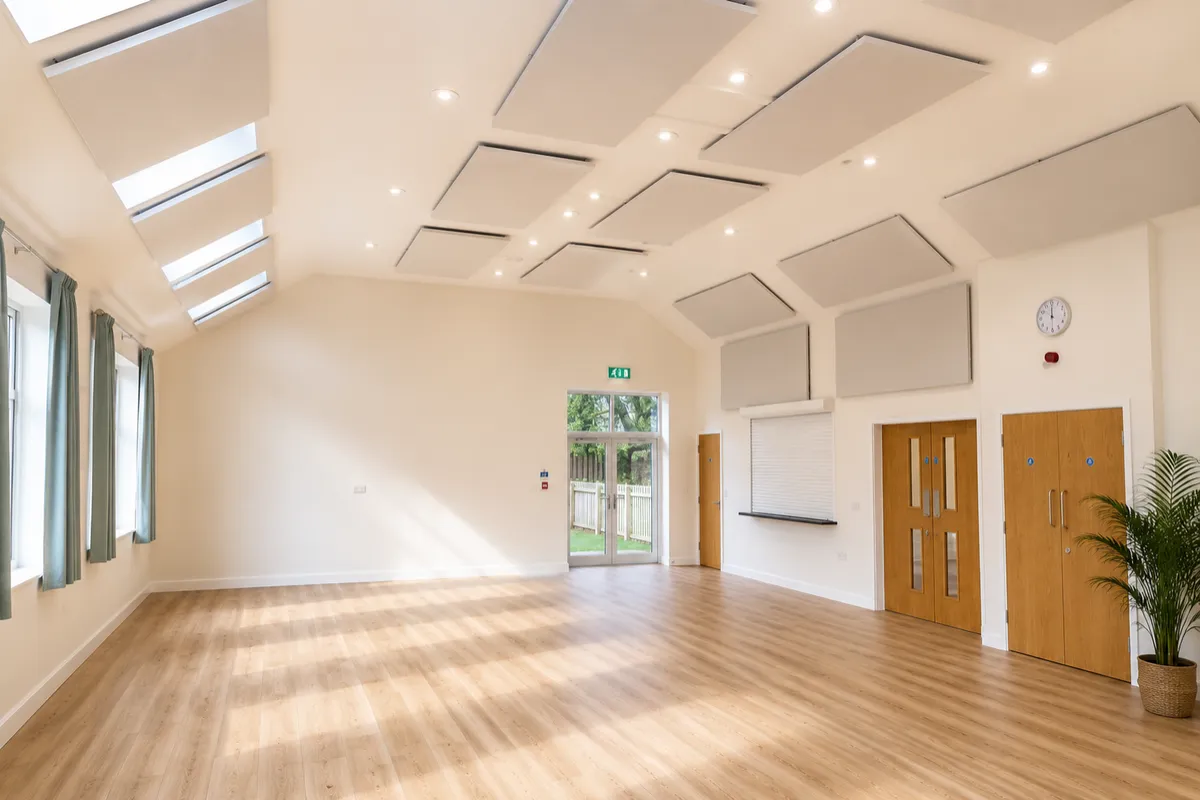 After: acoustic panels fitted to the village hall ceiling and walls