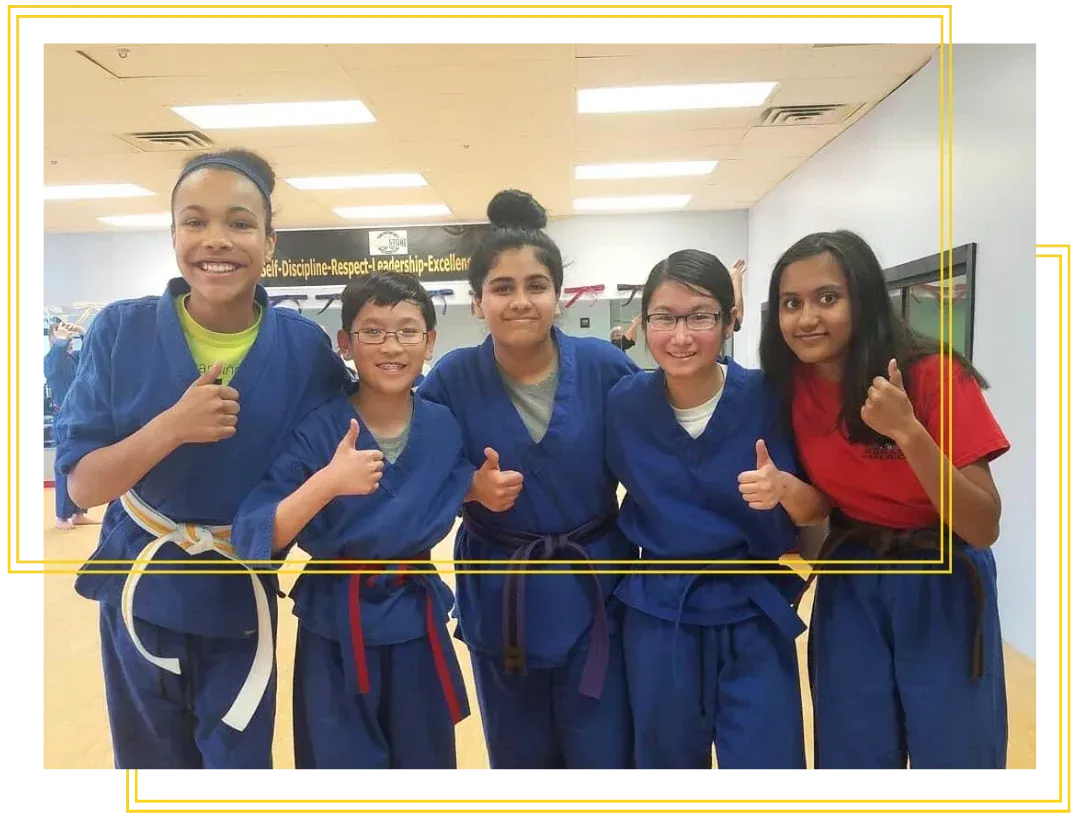 Girls wearing martial arts uniforms at Touchstone