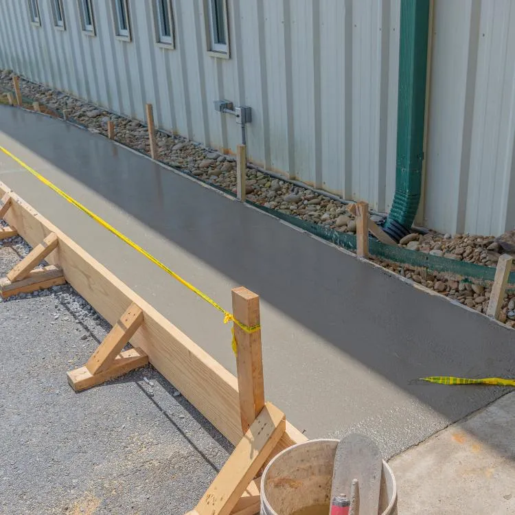 Concrete sidewalk being poured