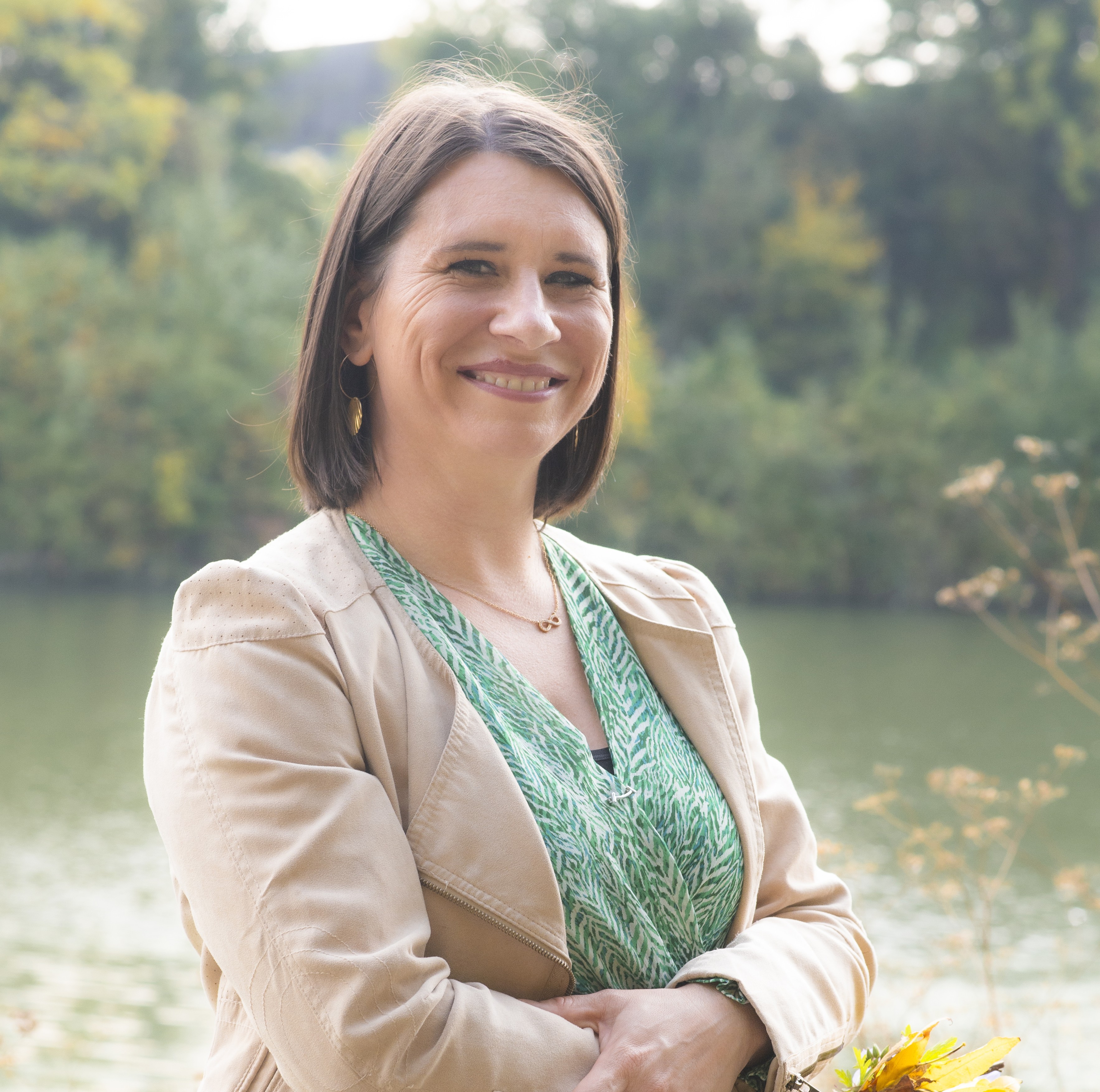 gold buddha figurine on brown rock